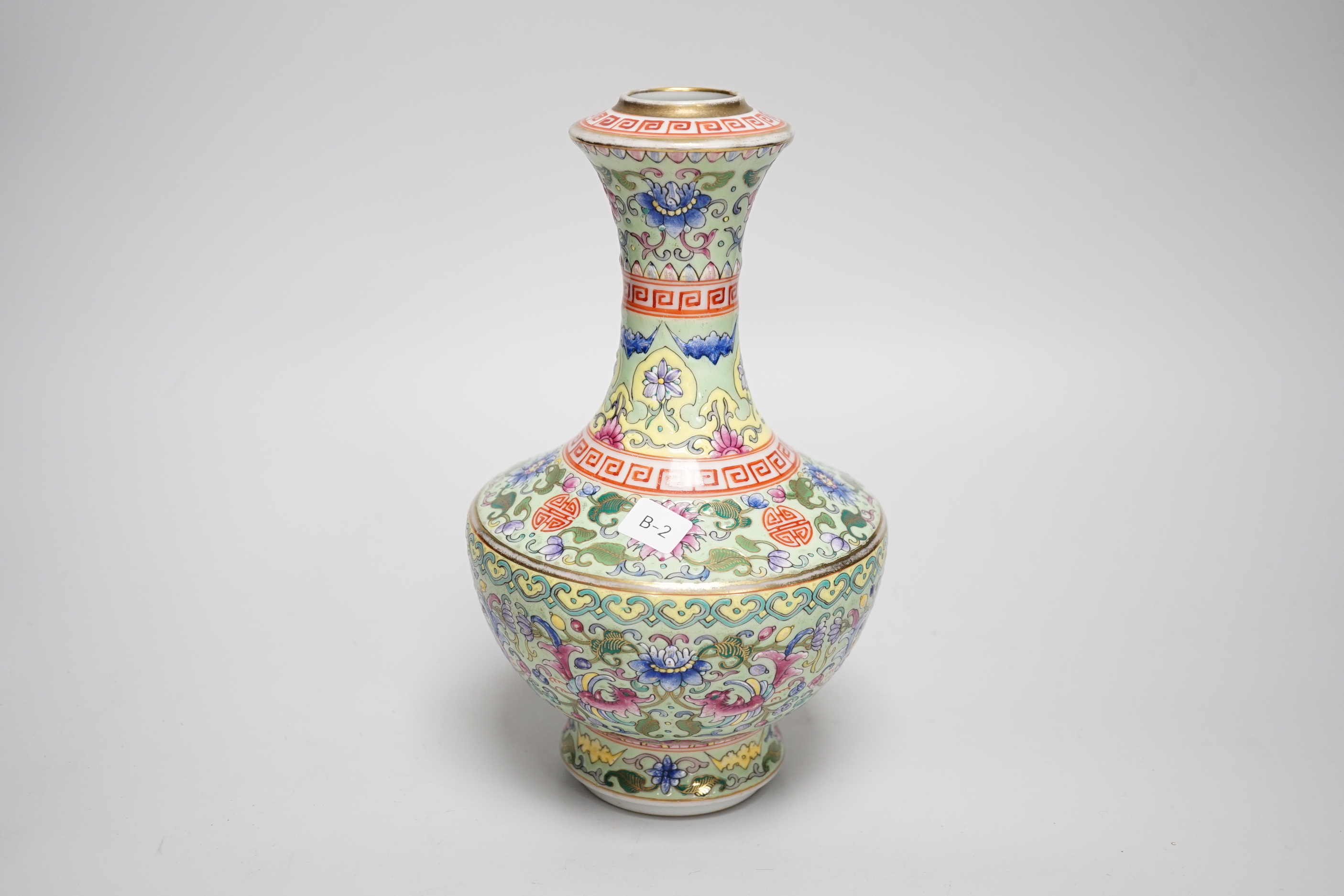 A Chinese enamelled porcelain celadon ground vase, 23.5cm